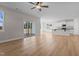 Open living room with kitchen view and sliding glass doors at 22 Laramie Ln, Selma, NC 27576