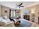 Living room with gray couches, coffee table, and a large TV at 2216 Lawrence Dr, Raleigh, NC 27603