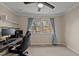 Home office with a view, desk, chair, and built-in shelving at 2942 Woodside Ave, Graham, NC 27253