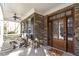 Front porch with stone accents and a wooden door at 3012 Bear Oak Ln, Cary, NC 27519