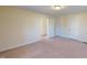 Bedroom with carpet, neutral walls, and doors to other rooms at 308 E First St, Princeton, NC 27569