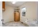 Bright laundry room with cabinets, shelving and a sink at 308 E First St, Princeton, NC 27569