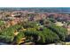 Aerial view of property showcasing house and surrounding trees at 3214-3220 Tump Wilkins Rd, Stem, NC 27581