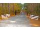 White fence and black metal gate with deer and horse accents at 3214-3220 Tump Wilkins Rd, Stem, NC 27581