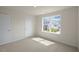 Bright bedroom with large window and closet at 409 Blue Aspen Dr, Fuquay Varina, NC 27526