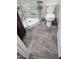 The spacious bathroom boasts modern tile flooring and a sleek glass shower at 409 Granville St, Oxford, NC 27565