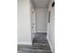 Hallway with gray wood-look flooring and white doors at 409 Granville St, Oxford, NC 27565