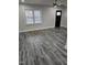 Spacious living room with gray flooring and large windows at 409 Granville St, Oxford, NC 27565