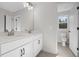 Double vanity bathroom with toilet and window at 41 Red River Dr, Selma, NC 27576