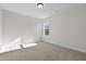 Spacious bedroom with large window and carpet at 41 Red River Dr, Selma, NC 27576