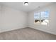 Charming bedroom with a large window and carpet at 41 Red River Dr, Selma, NC 27576