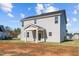 Two-story house with gray siding and covered patio at 41 Red River Dr, Selma, NC 27576