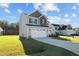 Front view of two-story house with gray siding, two-car garage at 41 Red River Dr, Selma, NC 27576