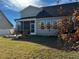 House with screened porch and deck overlooking a grassy backyard at 412 Airedale Trl, Garner, NC 27529