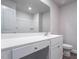 Modern bathroom with white vanity, toilet and shower at 502 Azalea Gaze Dr, Youngsville, NC 27596