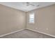 Cozy bedroom with neutral carpeting, ceiling fan and a window at 502 Lemontree Ct, Graham, NC 27253