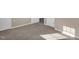 Well-lit bedroom with neutral carpet and ample closet space at 502 Lemontree Ct, Graham, NC 27253