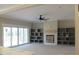 Living room with built-in shelving, fireplace, and sliding glass doors at 55 Basil Ct, Franklinton, NC 27525