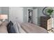 Spacious bedroom with double doors leading to the hallway and a view into the dining area at 712 Apple Churn Dr, Fuquay Varina, NC 27526