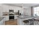 Modern kitchen with stainless steel appliances and gray countertops at 712 Apple Churn Dr, Fuquay Varina, NC 27526