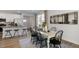 Bright kitchen features island with seating, stainless steel appliances, and ample counter space at 712 Apple Churn Dr, Fuquay Varina, NC 27526
