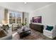 Relaxing living area with plush seating, large windows, and a view of the outdoors at 712 Apple Churn Dr, Fuquay Varina, NC 27526