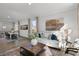 Open living room with a cozy seating area and views into the dining area at 712 Apple Churn Dr, Fuquay Varina, NC 27526