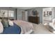 Main bedroom with king-size bed and large dresser, near ensuite bathroom at 712 Apple Churn Dr, Fuquay Varina, NC 27526