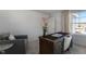 Spacious home office with a comfortable seating area and large windows at 716 Apple Churn Dr, Fuquay Varina, NC 27526