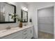 Double vanity bathroom with walk-in closet access at 718 Apple Churn Dr, Fuquay Varina, NC 27526