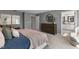 Main bedroom with king bed, dresser, and ensuite bathroom access at 720 Apple Churn Dr, Fuquay Varina, NC 27526