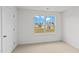 Spacious bedroom with large window and plush carpeting at 7549 Michelle Rd, Rocky Mount, NC 27803