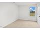 Spacious bedroom with neutral carpeting and large window at 7549 Michelle Rd, Rocky Mount, NC 27803