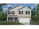 Two-story house with neutral siding, a white garage door, and landscaping at 7549 Michelle Rd, Rocky Mount, NC 27803