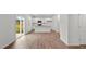 Kitchen with island, stainless steel appliances, and vinyl plank flooring at 7549 Michelle Rd, Rocky Mount, NC 27803