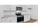 Modern kitchen features stainless steel appliances and granite countertops at 7549 Michelle Rd, Rocky Mount, NC 27803