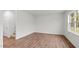 Living room with wood-look flooring and access to staircase at 7549 Michelle Rd, Rocky Mount, NC 27803