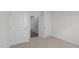 Spacious bedroom with an open door to hallway at 7586 Michelle Rd, Rocky Mount, NC 27803