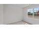 Spacious bedroom with a large window offering natural light and neutral-toned walls at 7586 Michelle Rd, Rocky Mount, NC 27803