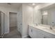 Double vanity, walk-in shower, and access to a large closet at 7622 Michelle Rd, Rocky Mount, NC 27803