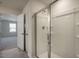 Modern bathroom with a large glass shower and an additional bedroom visible at 7622 Michelle Rd, Rocky Mount, NC 27803