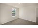 Simple bedroom with carpet flooring and a window at 7622 Michelle Rd, Rocky Mount, NC 27803