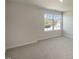 Bright bedroom with large window and plush carpeting at 7622 Michelle Rd, Rocky Mount, NC 27803