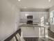 Kitchen with white cabinets, granite countertops, and island at 7622 Michelle Rd, Rocky Mount, NC 27803