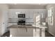 Modern kitchen with granite countertops and stainless steel appliances at 7622 Michelle Rd, Rocky Mount, NC 27803