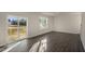 Living room with hardwood floors and sliding glass doors to deck at 7622 Michelle Rd, Rocky Mount, NC 27803