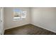 Room with wood-look flooring and a large window at 7622 Michelle Rd, Rocky Mount, NC 27803