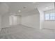 Large bonus room with gray carpet and multiple windows at 903 Birkdale Dr, Clayton, NC 27527