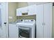 Laundry room with washer, dryer, and cabinets at 903 Birkdale Dr, Clayton, NC 27527