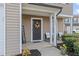 Inviting front porch with two chairs and a welcome sign at 906 Collington Dr, Mebane, NC 27302